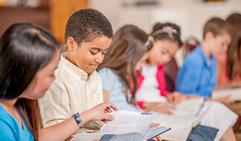 Children reading the Bible together