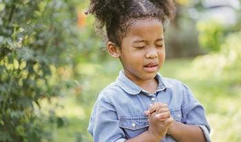 Young girl praying